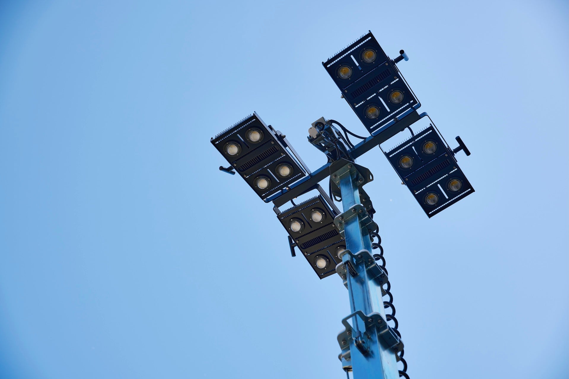 lighting tower view from the ground up with a blue sky